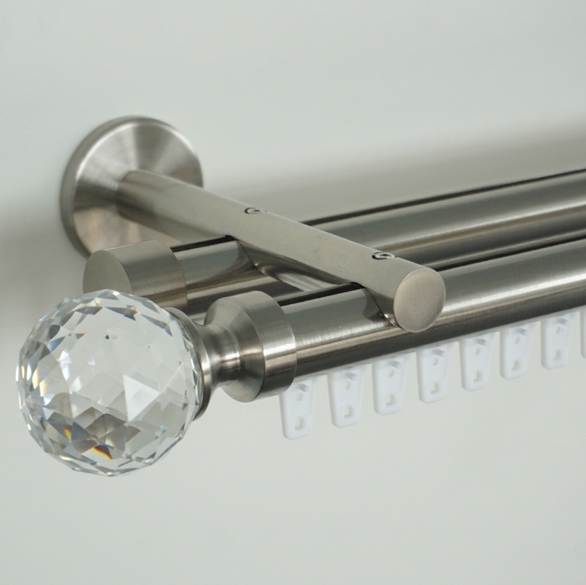 Curtain rod with crystal finial on a white background